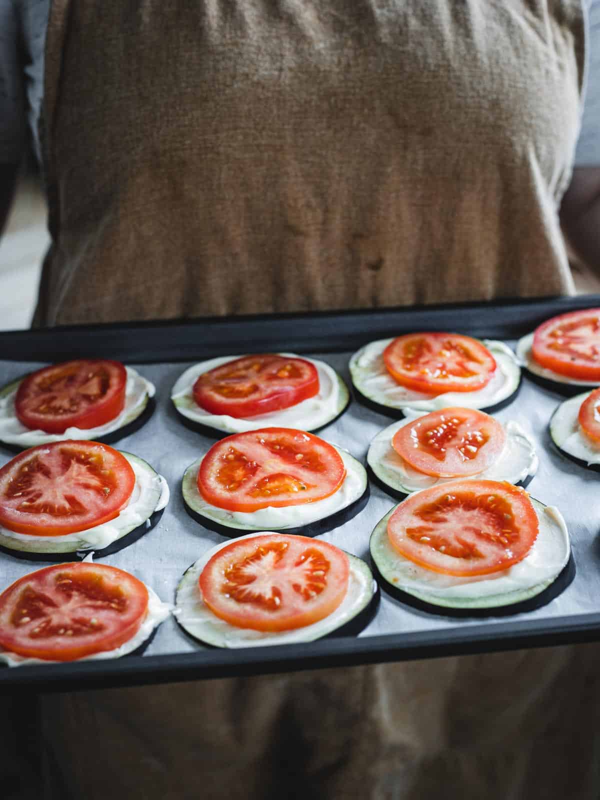 unbaked eggplants on baking sheet