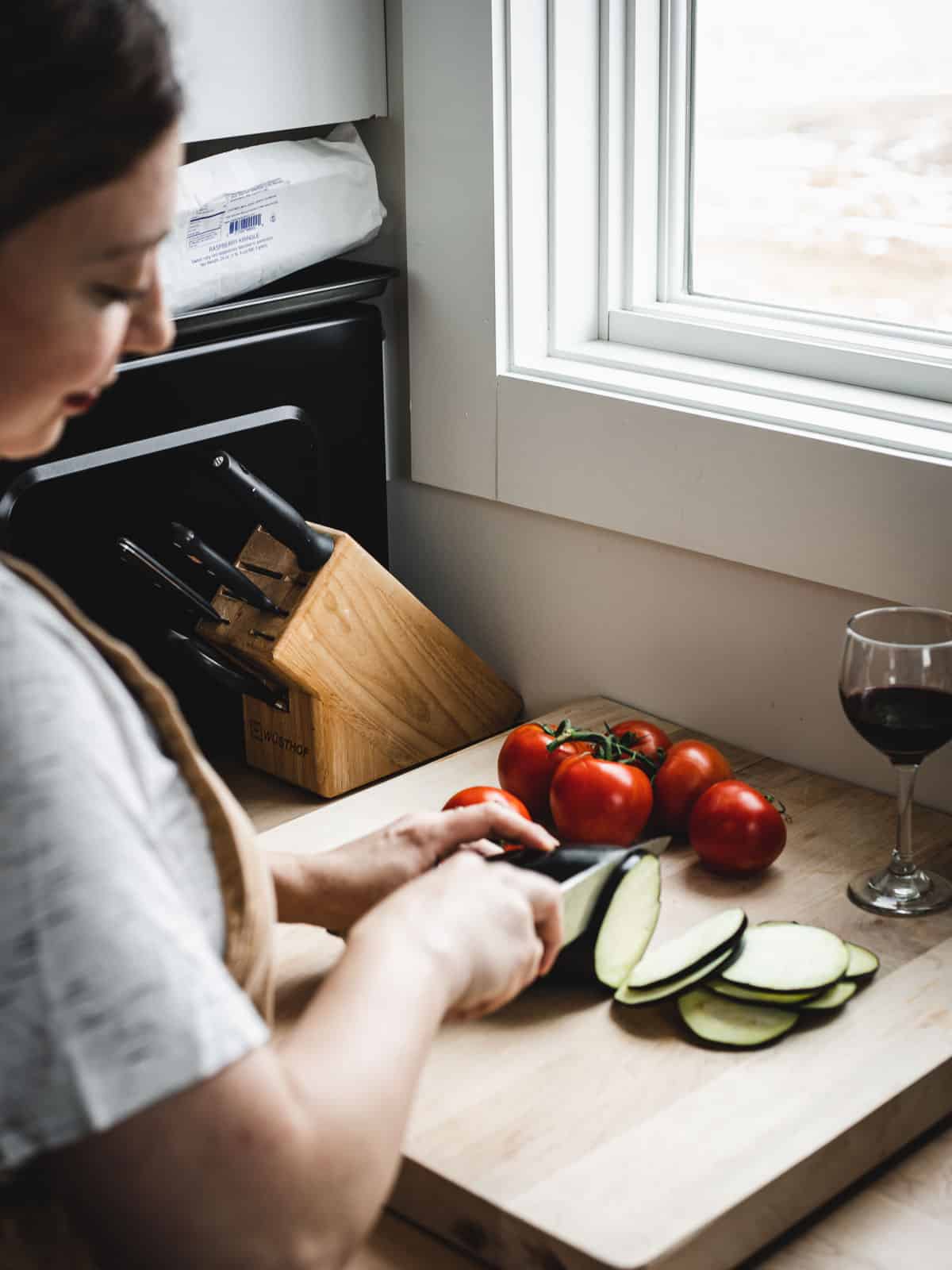 slicing eggplants and tomatoes