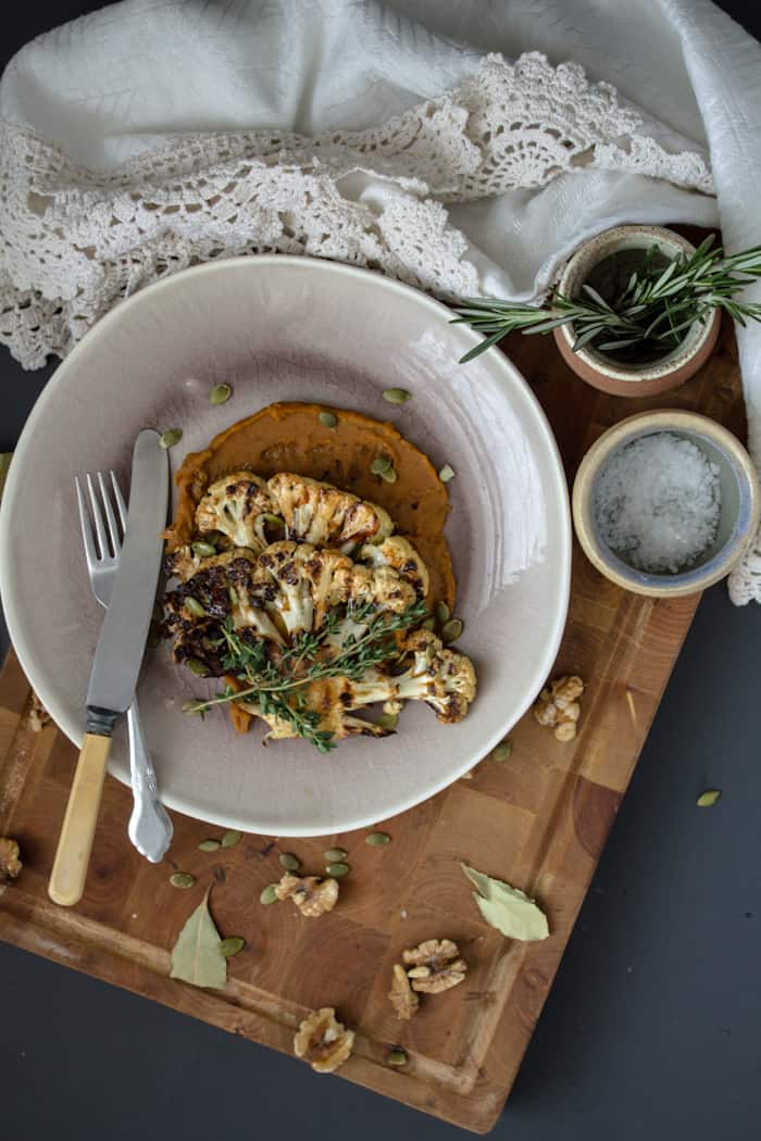 Roasted cauliflower steaks on spicy sweet potato puree