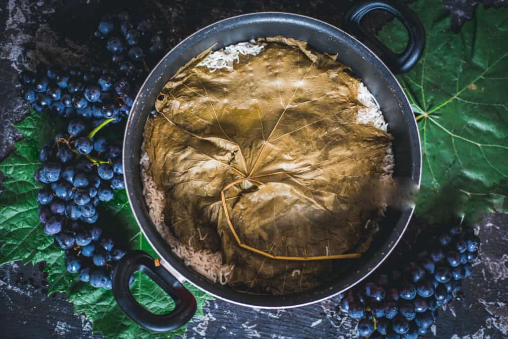 Rice pot topped with grape leaf