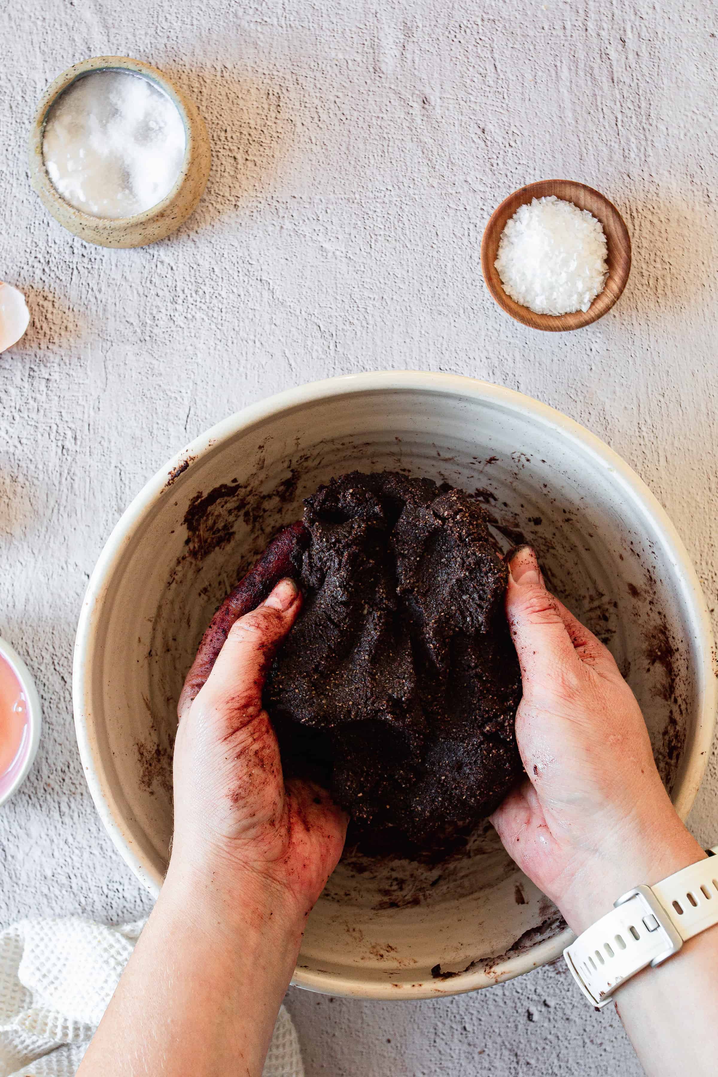 holding chocolate crust in bowl